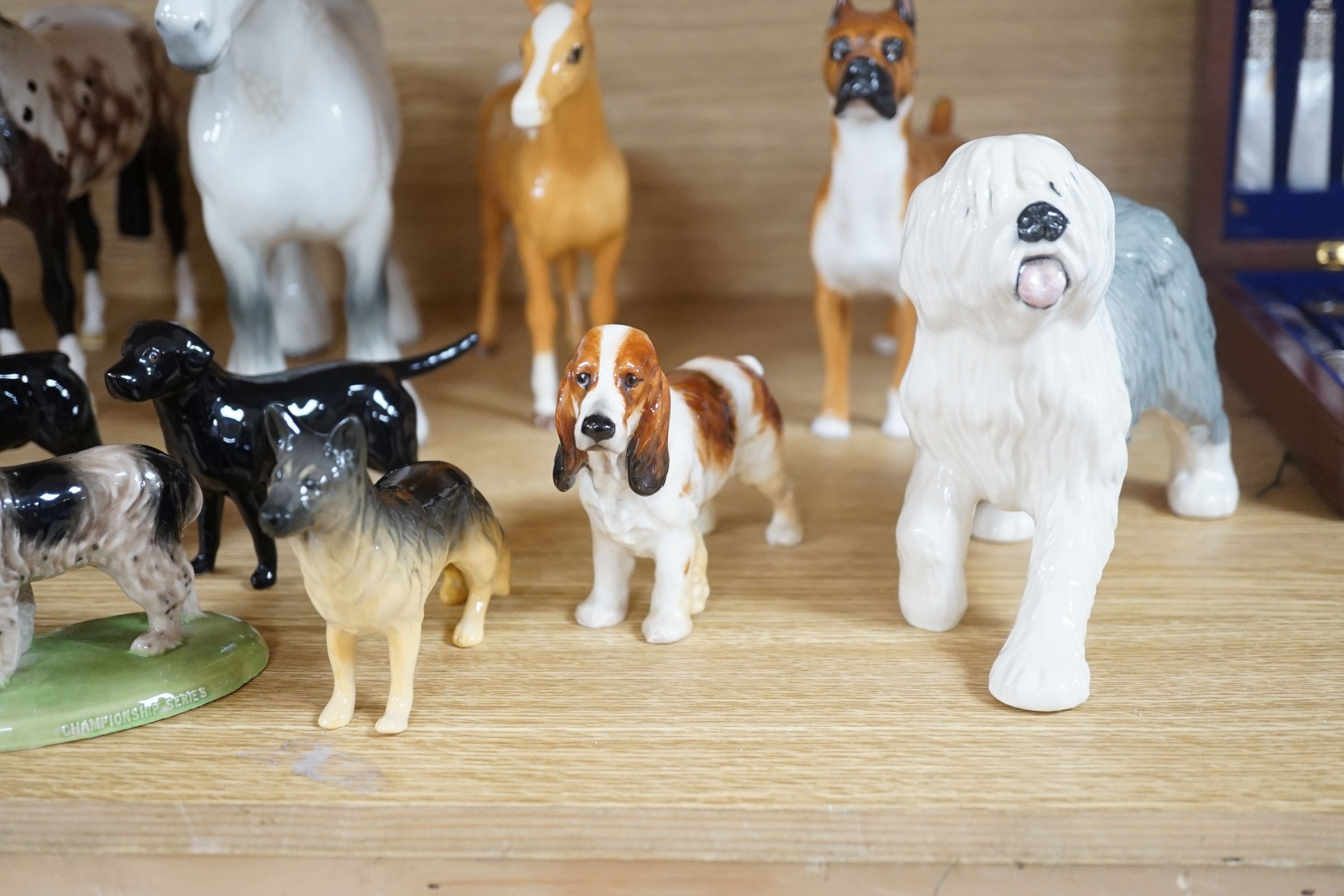 A large quantity of mixed Doulton, Beswick, dogs and horses, largest, Beswick shire horse 23cms high.